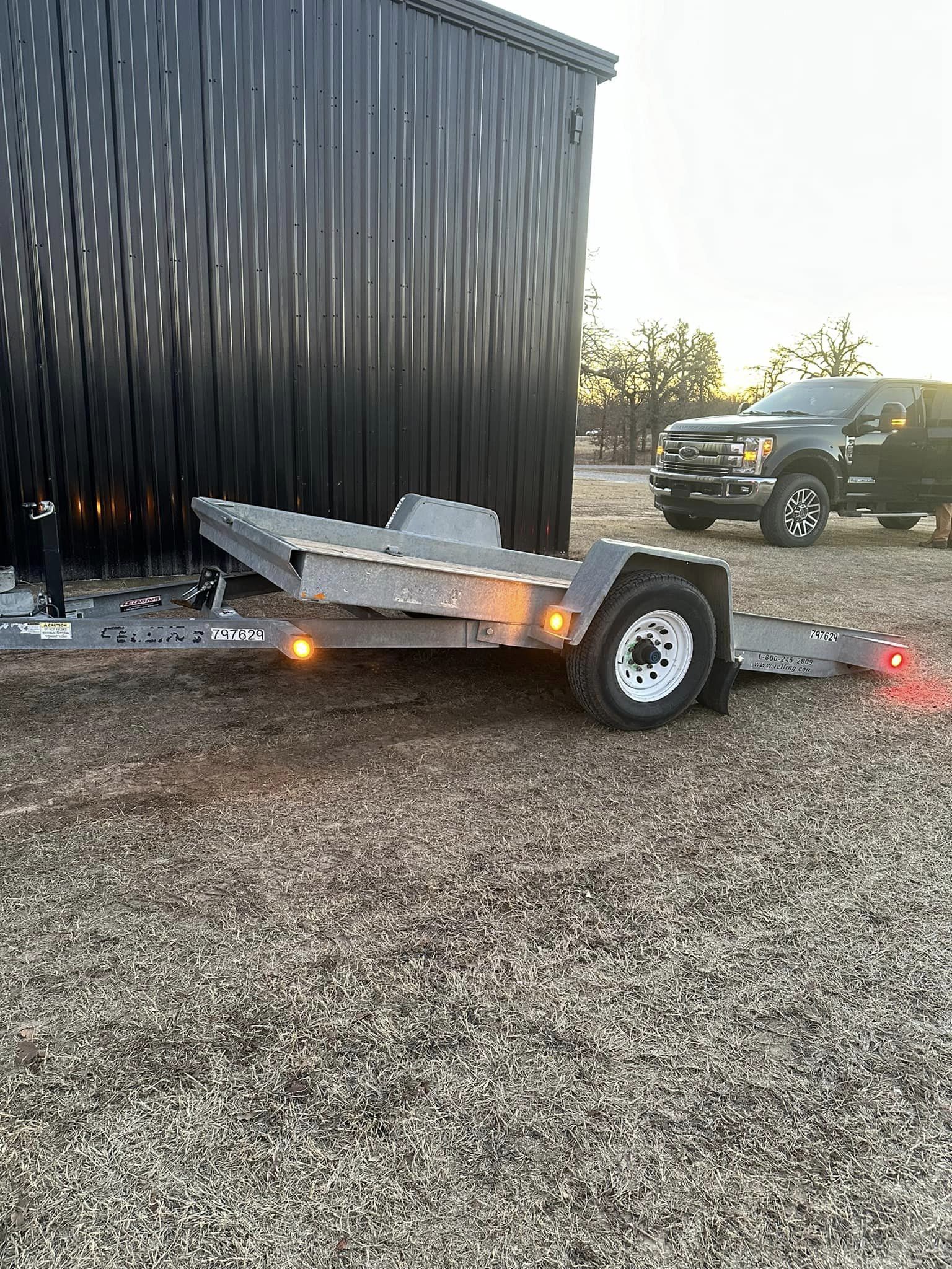 SOLD-12’ Felling commercial Tilt deck trailer.