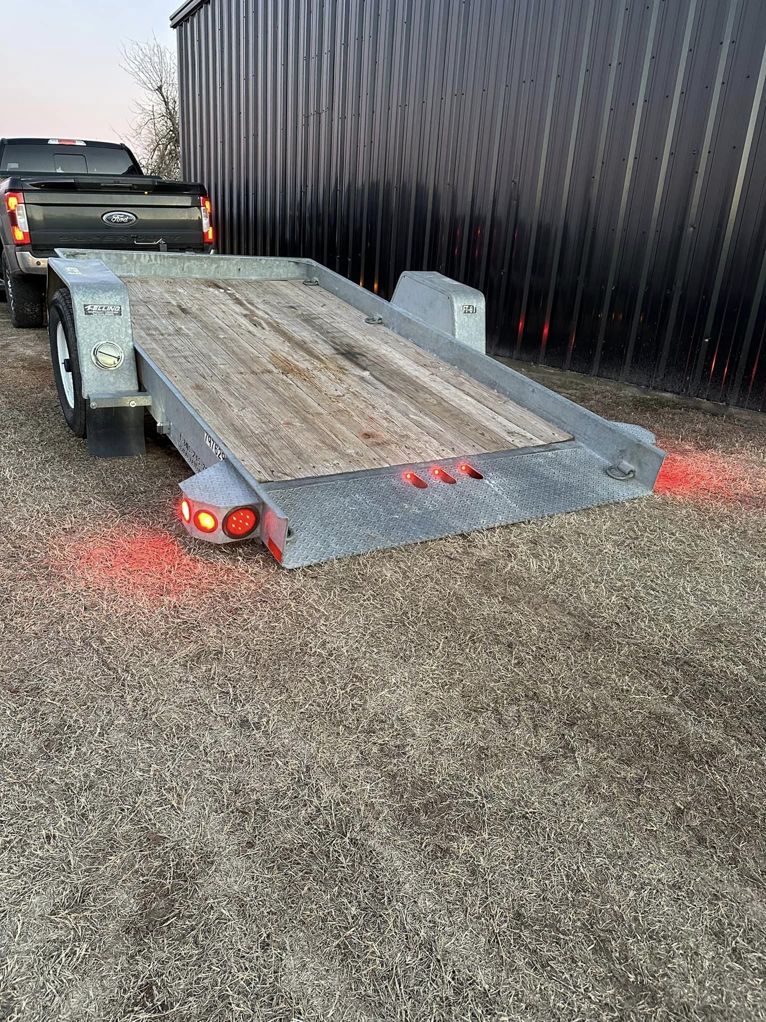 SOLD-12’ Felling commercial Tilt deck trailer.