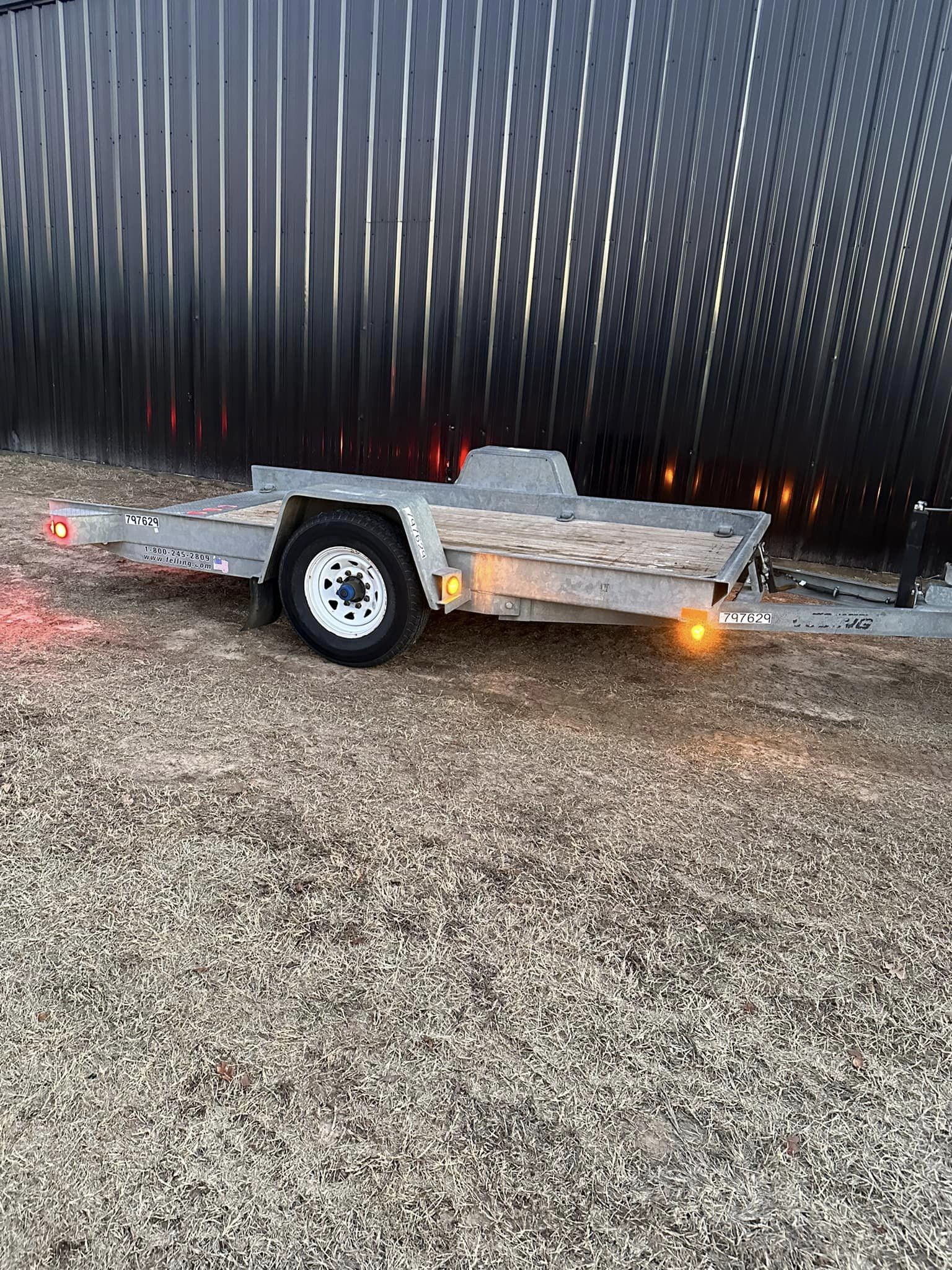 SOLD-12’ Felling commercial Tilt deck trailer.